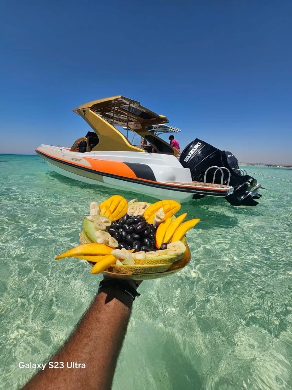 Fresh fruit platter aboard a private speedboat anchored in clear Red Sea water