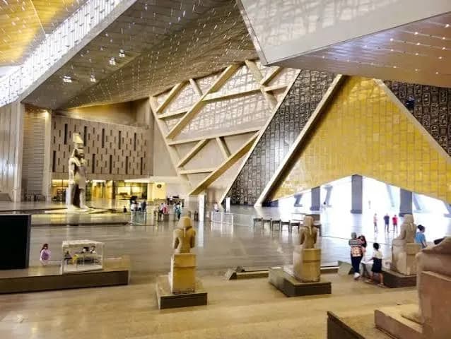 Ancient Egyptian statues on display inside the Grand Egyptian Museum's main hall