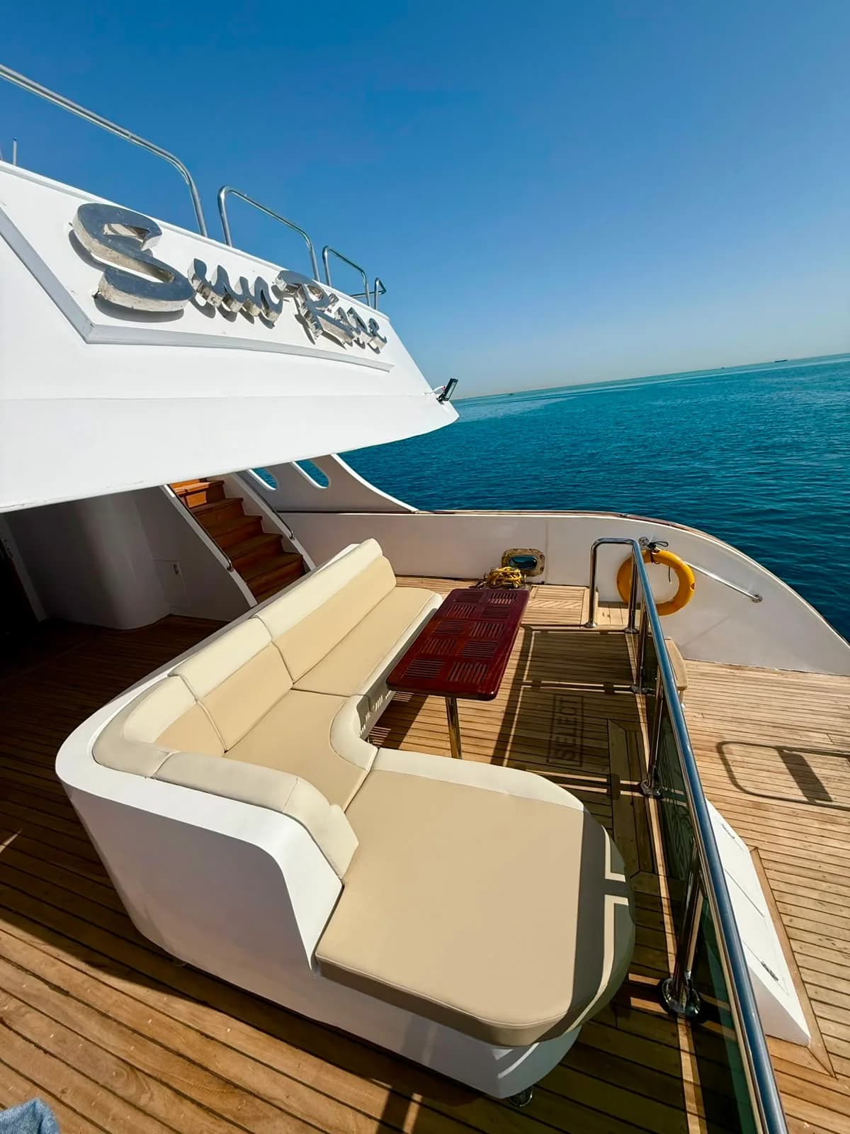 Upper deck seating area on the VIP sunset cruise yacht