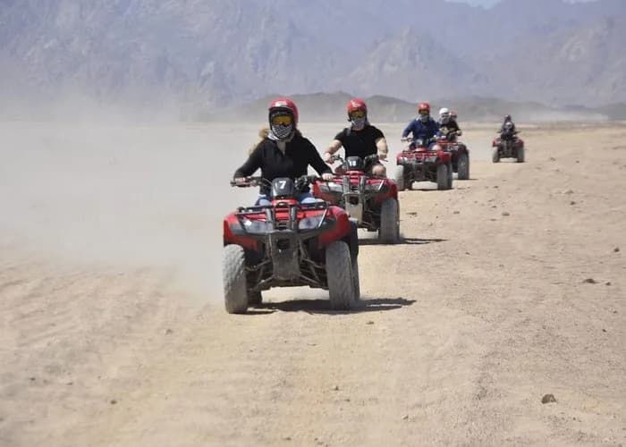 Group of quad riders crossing the desert