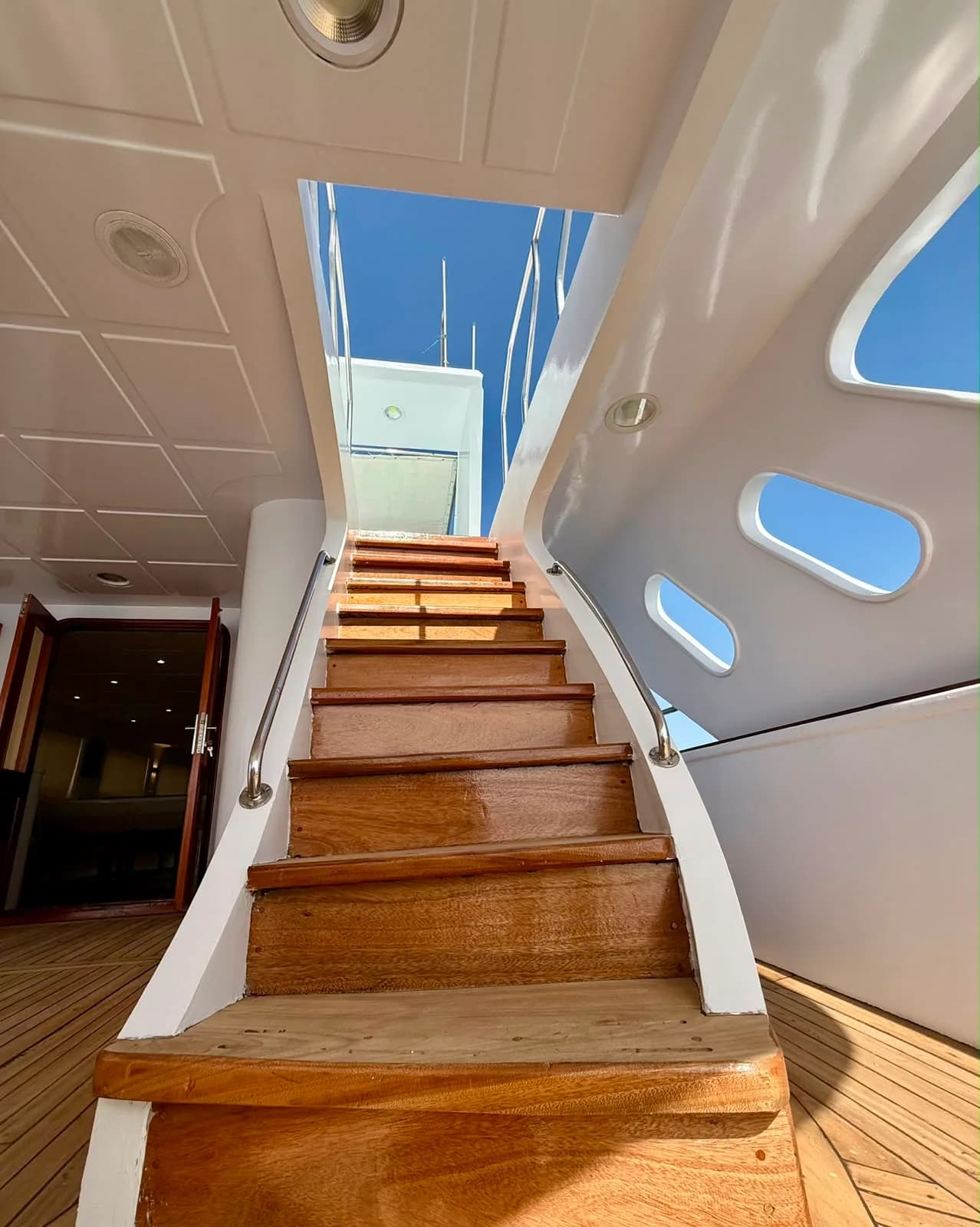 Staircase leading to the upper deck of the VIP sunset cruise yacht