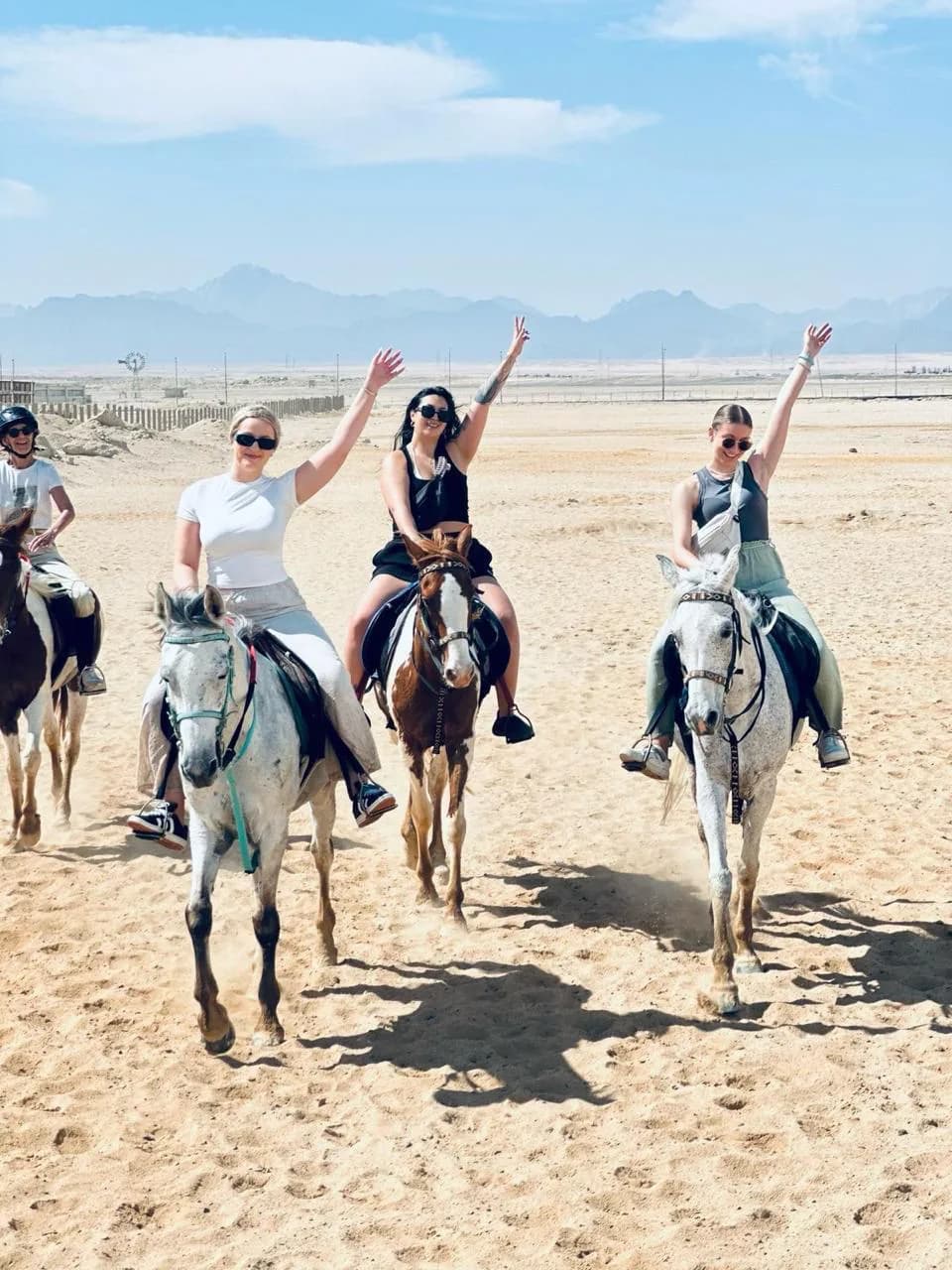 Horse riders crossing the desert